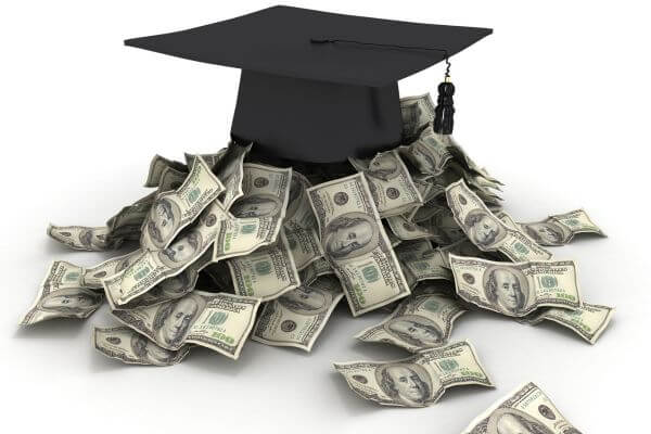 Picture of a graduation cap with cash underneath for how to pay for college without loans.