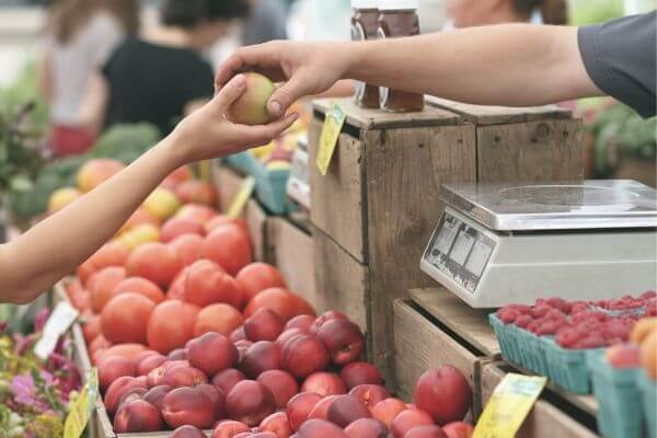How can I spend less money on groceries?