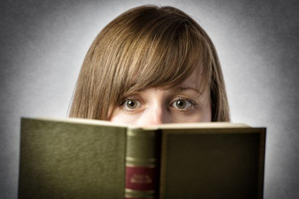 Picture of a lady reading life changing fiction books.