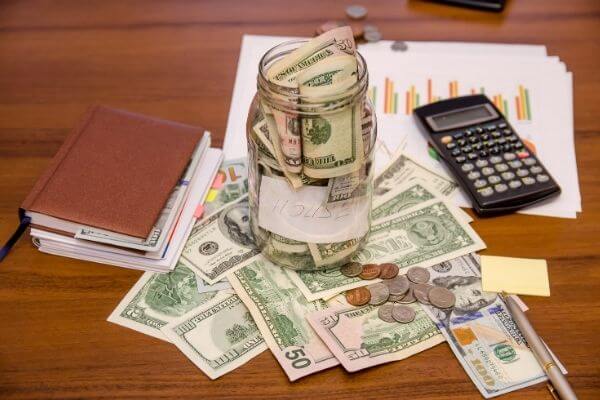 Picture of a scattered desk before starting thirty days of money challenges.