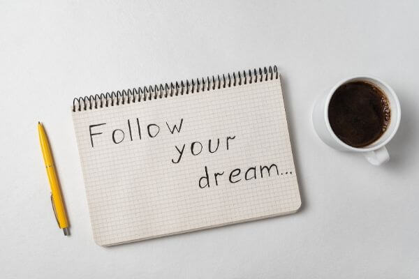 Picture of a sign that says follow your dream.