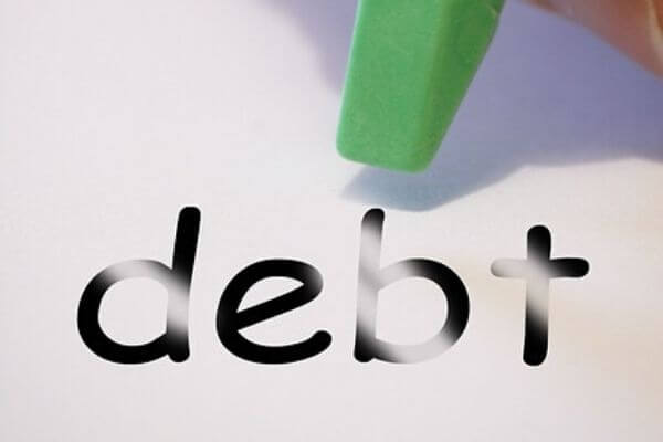 Picture erasing the word debt for the best financial management books to pay off debt.