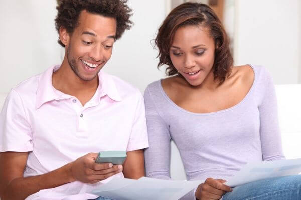 Picture of couple discussing why is money everything.