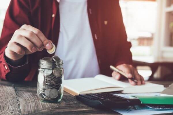 Picture of someone writing down the meaning of their slush fund