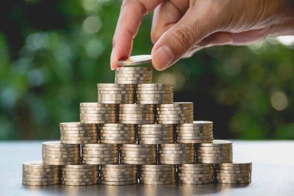 A stack of coins in a pyramid to show the steps to be smart with money.