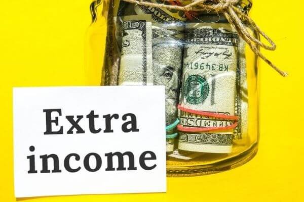 Picture of a sign that says extra income.