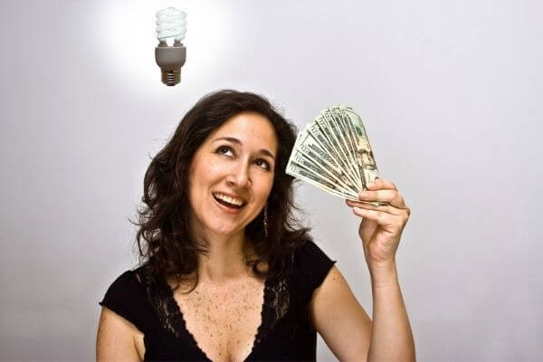 A picture of a lady thinking about the answers to the money block quiz.