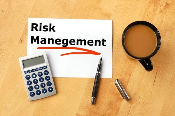 Picture of a sign that says Risk management which is a key part of Teri's investing strategy