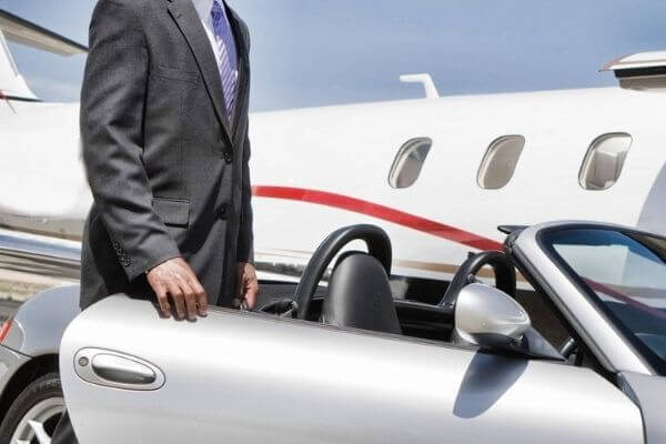 Picture of a private plane and convertible for billionaire morning routine examples.