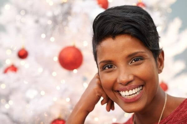 Picture of a smiling lady for how can I make sure my no gift Christmas is still fun.