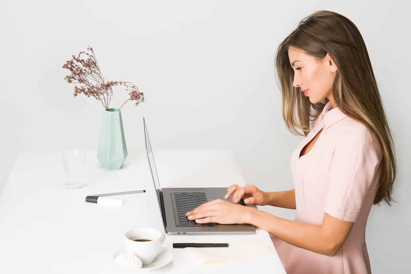 Picture of a lady learning how to budget on a computer. 