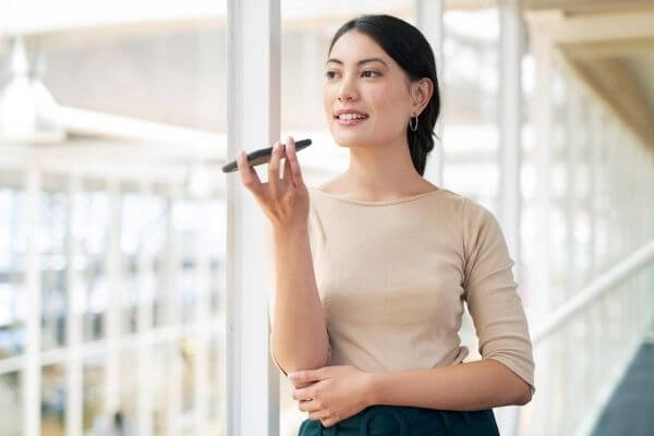 Picture of a lady talking on a phone.