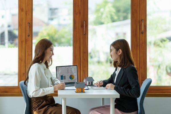 Picture of Ladies discussing if a real estate career path is for them.