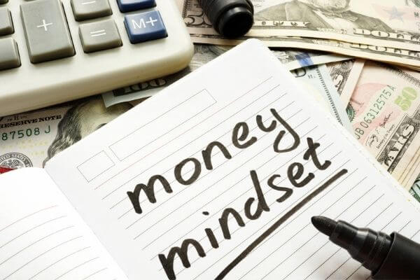 Picture of a journal with the words money mindset on how to change your mindset for success.