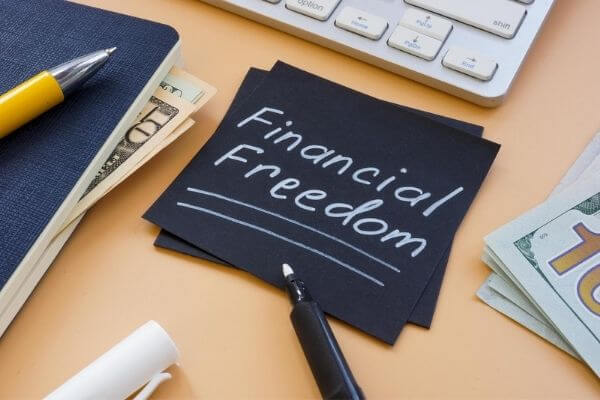 Picture of a sign that says financial freedom for why choose financial independence.