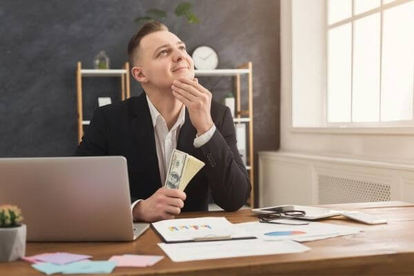 Picture of a guy working on a laptop for the best online jobs paid weekly.