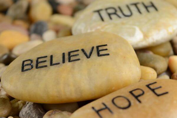 Picture of rocks with the words hope, believe, and truth on them.