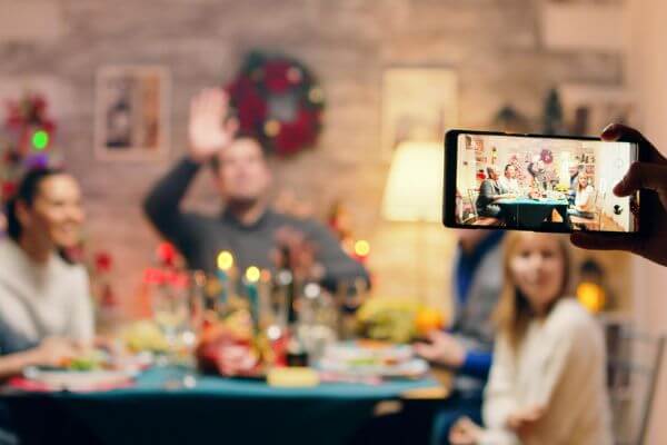 Picture of someone taking a picture for what do people typically eat on Christmas day.