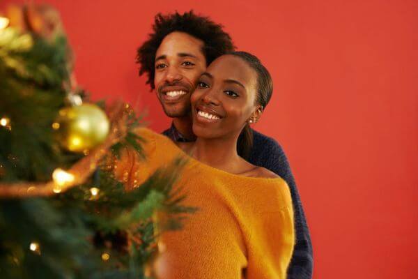 Picture of a couple for what traditions people have on Christmas day.