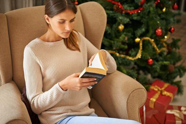 Picture of a lady reading a book.