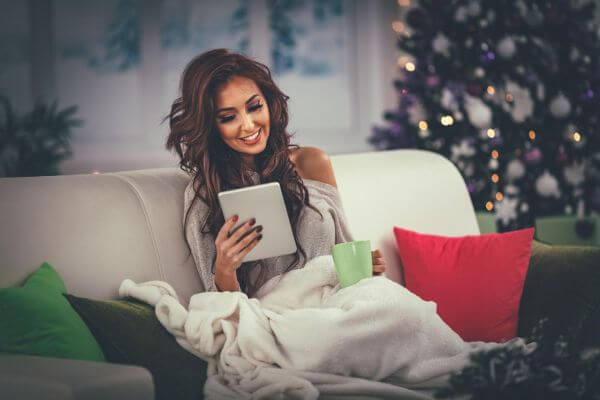 Picture of a lady relaxing on a couch for things to do on Christmas Day.