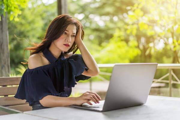 Picture of a lady working on a laptop