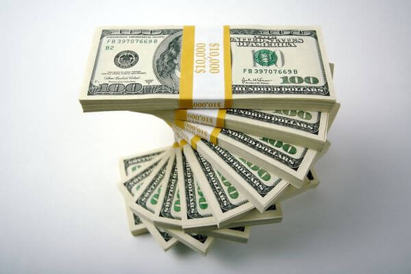 Picture of spiral stack of dollar bills in 10000 bundles for the best ways to make 10k a month