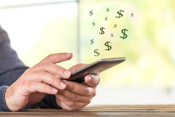 Picture of someone using their phone to find ways to make 500 dollars fast.