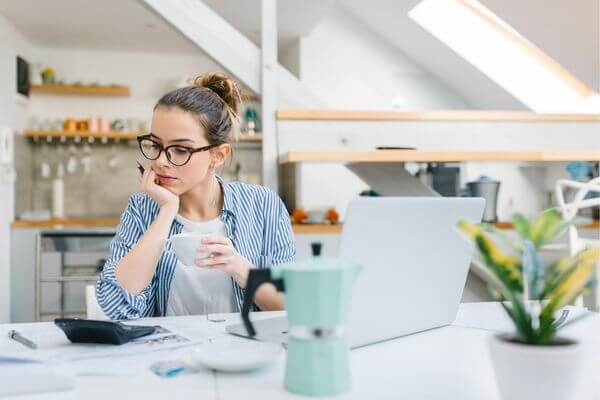 Picture of a lady determining what method is best for sticking to a budget