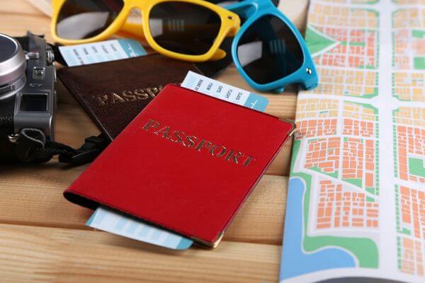 Picture of passport and sunglasses for how much cash should I take on a cruise.