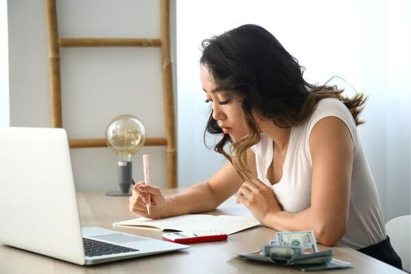 Picture of someone working on a family emergency email sample