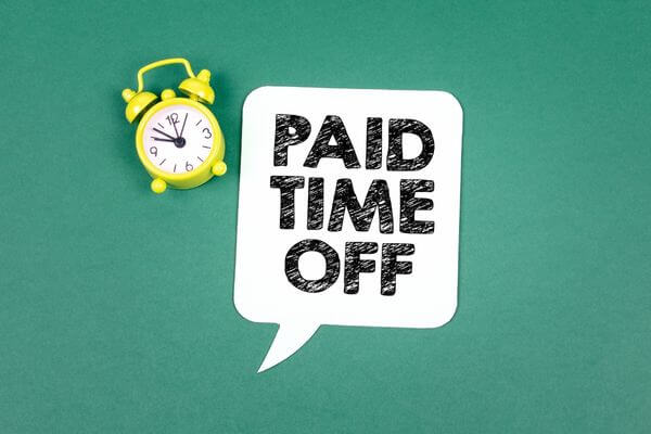Picture of a sign that says Paid Time Off for how do holidays affect working days.