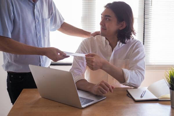 Picture of a guy looking up resources on a laptop.