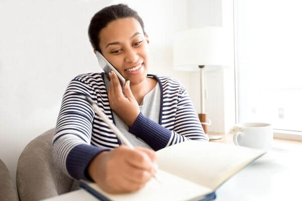 Picture of a woman working from home.