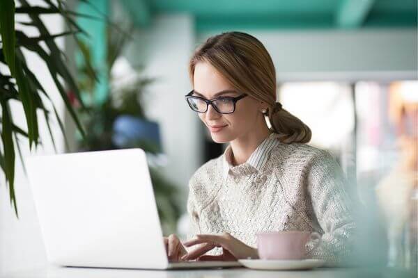 Picture of a lady taking an online class.