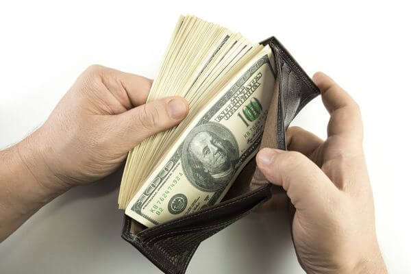 Picture of a wallet with cash for simple Ways To Increase Your Hourly Wage of $36 per hour