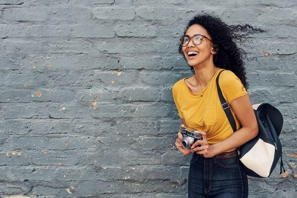 Picture of a lady taking pictures for summer jobs for teachers.