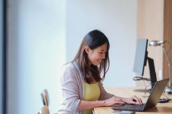 Picture of a lady working as a graphic designer from home.