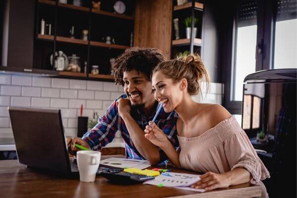 Picture of a couple discussing why total net worth and liquid net worth are so different.