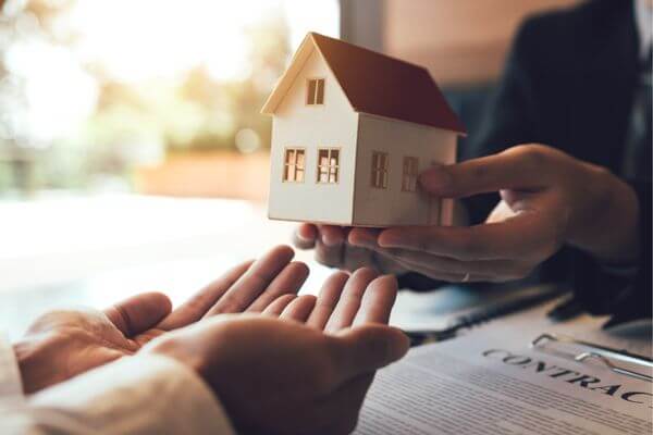 A picture of a small house showing the value of a house over time