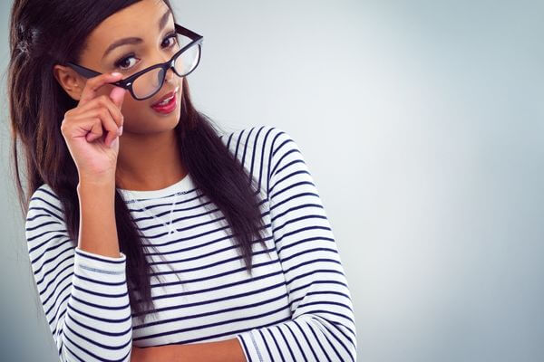 Picture of a lady looking over her glass for how to deal with the don't want to work situation.