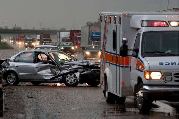 Picture of a car accident and traffic backup.