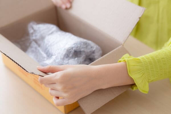 Picture of someone opening a package.