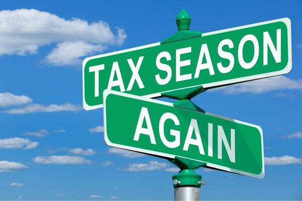 Picture of a sign that says tax season again for reason you may owe taxes this year.