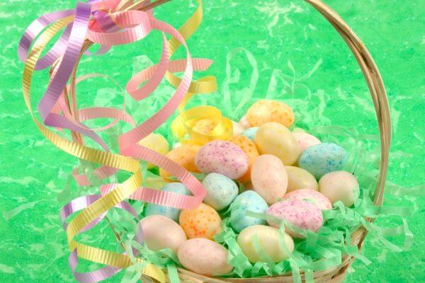 Picture of an Easter basket filled with eggs for the best easter basket ideas for girls.