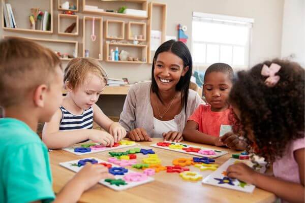 Picture of a young teacher working as a babysitter or nanny.