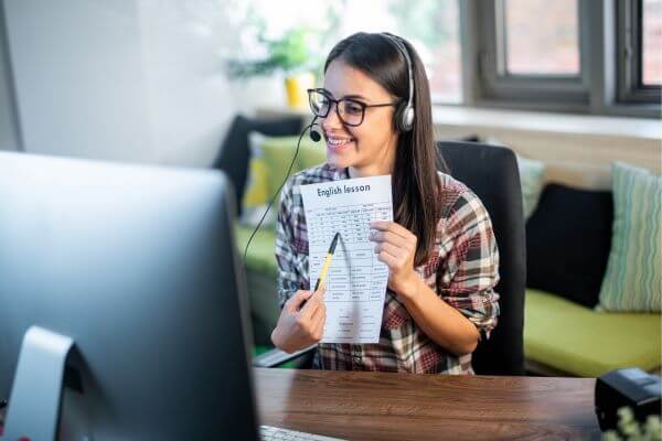 Picture of a teacher teaching an online english as a second language class.