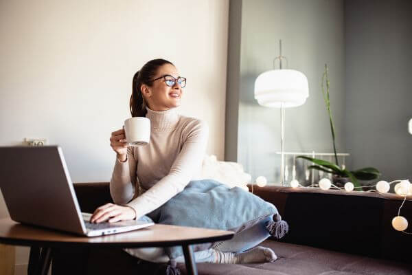 Picture of a women working on a laptop for best non phone work from home jobs.