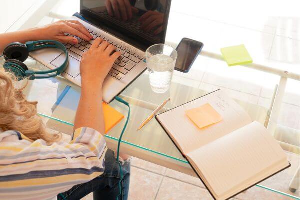 Picture of someone typing on laptop as a writer