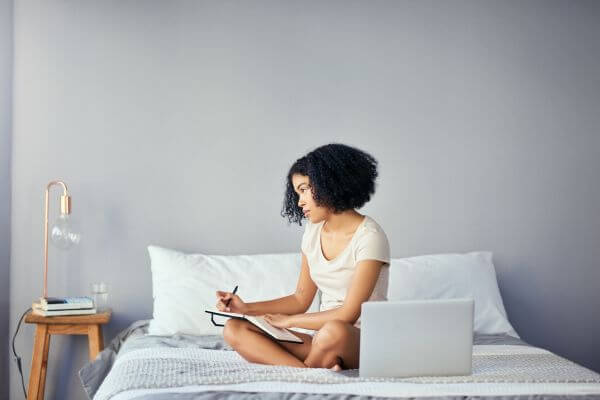 Picture of someone writing in a gratitude journal.